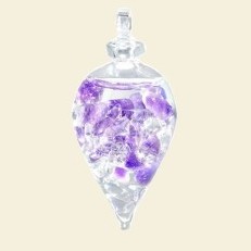 Discover the healing power of stones with this amethyst, purple semi precious stone and rock crystal in a glas pendant