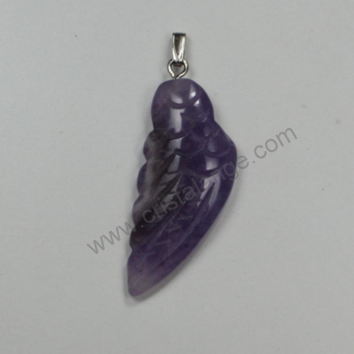 Discover the energetic properties of gemstones and semi precious stones, as well as our guardian angel jewels, here an amethyst angel wing pendant, purple stone.