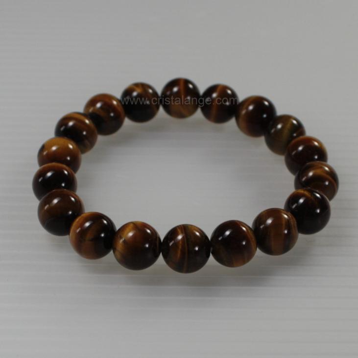 Discover the energetic properties of gemstones and semi precious stones, here a tiger's eye bracelet, golden brown stone