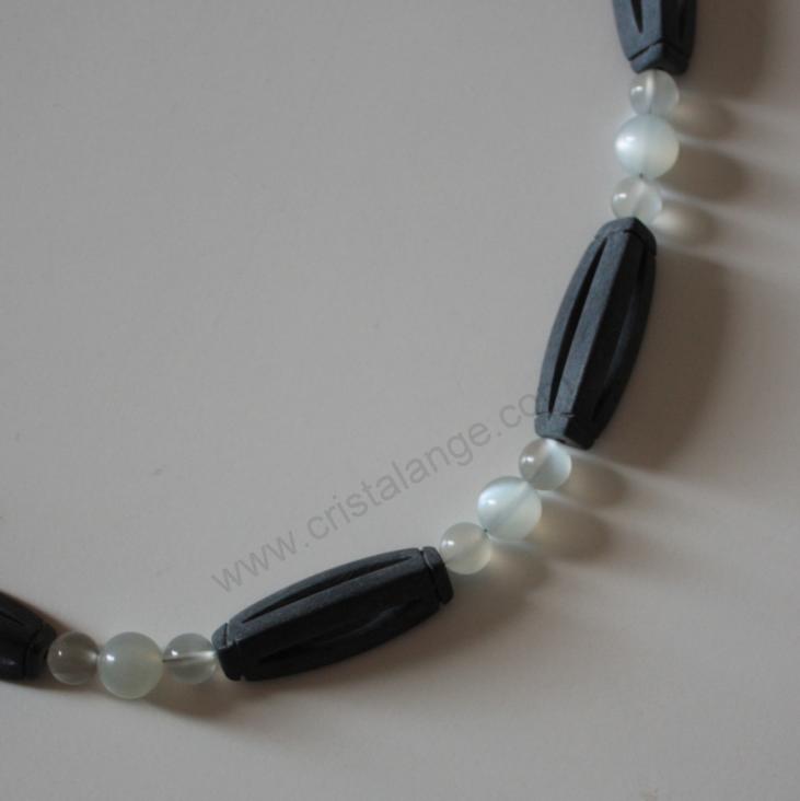 Use the healing power of gemstones with this moonstone and black stone necklace