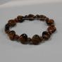 Discover the energetic properties of gemstones and semi precious stones, here a tiger's eye bracelet, braun stone