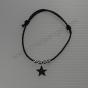 Silver star on a cord bracelet