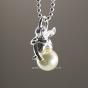 Necklace with sleeping mini guardian angel on a white pearl