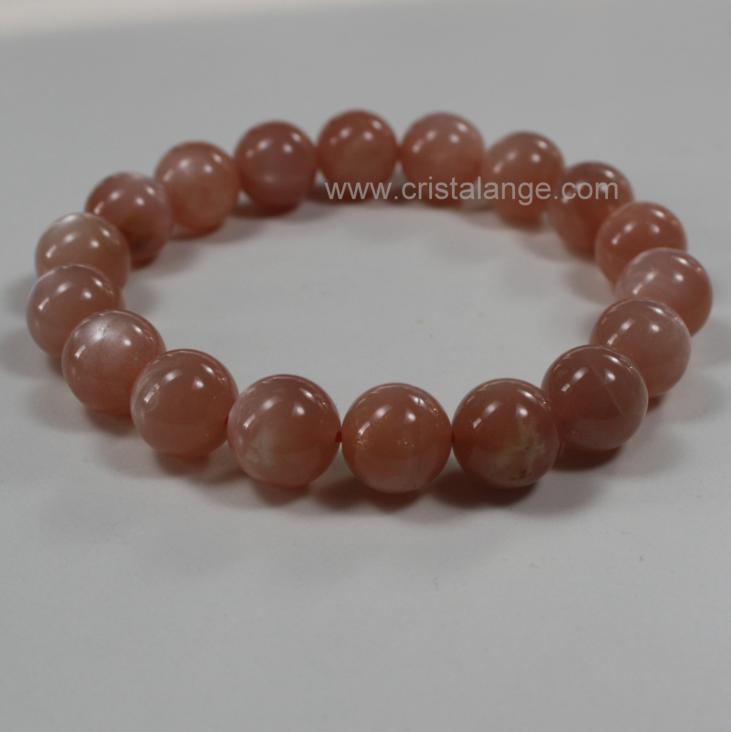 Découvrez le pouvoir des pierres en lithotherapie avec ce bracelet en pierre de lune orange, pierre semi précieuse, et bien d'autres sur le site de vente en ligne de bijoux pierres Cristalange.com